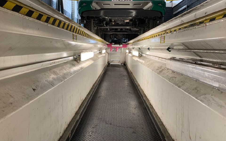 Vehicle inspection pit for the safe servicing of Adams Morey, Southampton’s commercial vehicles, and galvanised, anti-slip steps