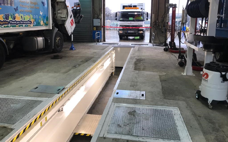 Prefabricated steel vehicle inspection pit, featuring hazard markings, integrated lighting and shaker plates, installed at Biffa’s Anglesey depot in North Wales by CCS Garage Equipment