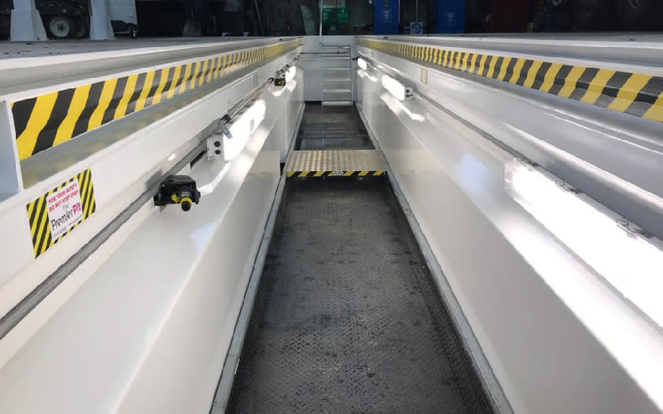 Garage equipment installation featuring steel prefabricated commercial vehicle inspection pits for safe inspection of commercial waste management vehicles at Biffa’s North Wales depot by CCS Garage Equipment