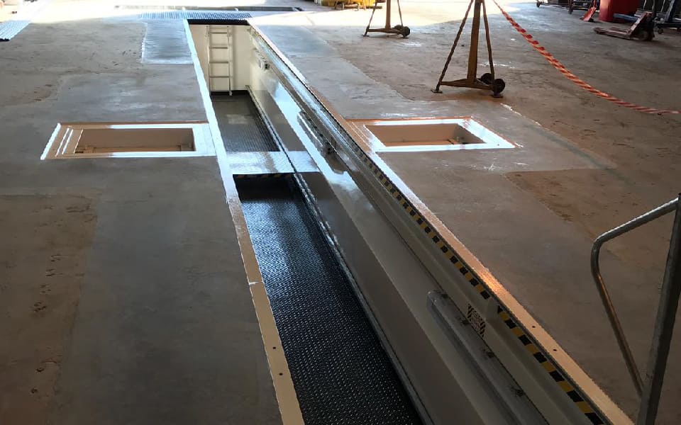 Installation of bespoke new steel commercial vehicle inspection pit by CCS Garage Equipment at Biffa, Roche in Cornwall, part of our waste management depot workshop refurbishment