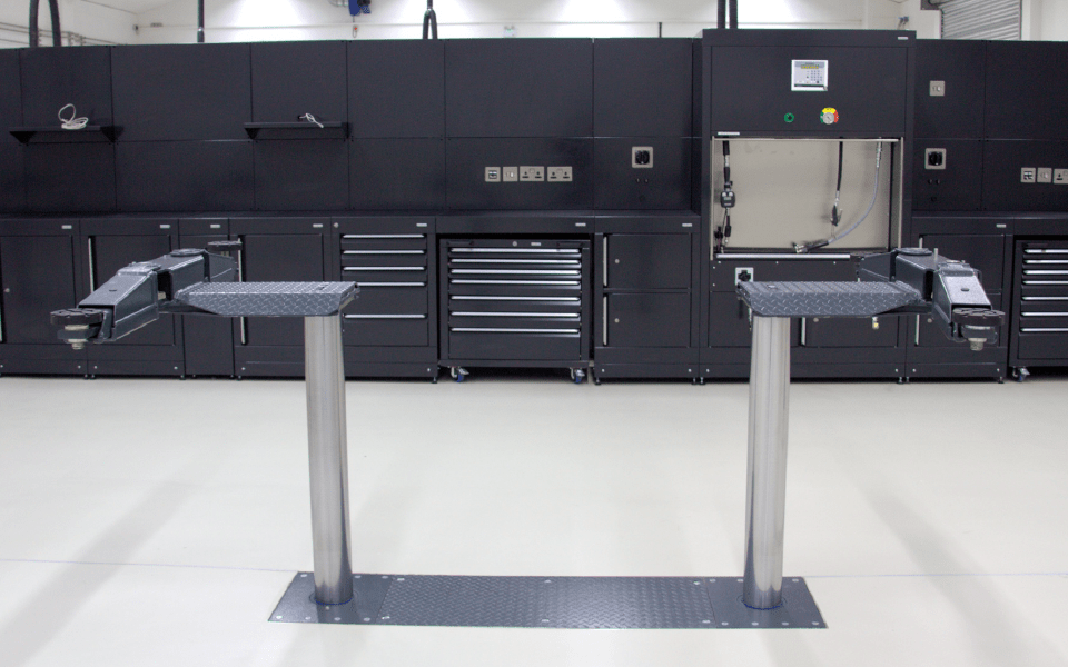 In-ground, 2-post vehicle lift installation customised for low-profile vehicles, installed by CCS Garage Equipment for Charles Hurst, Belfast