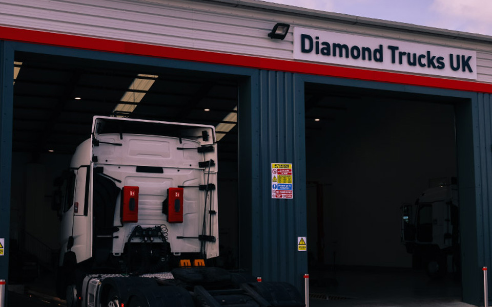 The external elevation of the Diamond Trucks Warrington workshop, offering excellent vehicular access to the roomy workshop's 12 commercial vehicle servicing bays