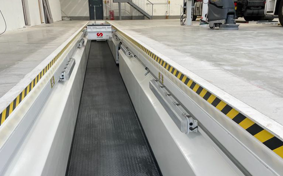 Completed installation of bespoke steel inspection pit in commercial vehicle workshop