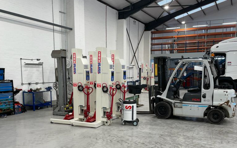 Mobile column lifts by Stertil Koni for versatile vehicle lifting in this commercial vehicle workshop
