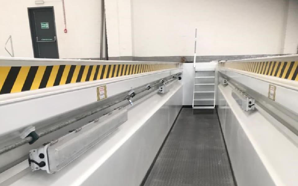 Internal works progress at CCS Garage Equipment's commercial workshop installation, featuring bespoke prefabricated steel inspection pits