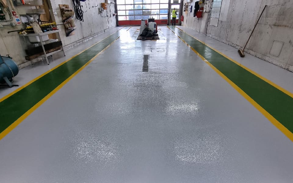 New and improved surface after diamond-grinding the workshop floor and installing epoxy resin floor paint at East Midlands Airport