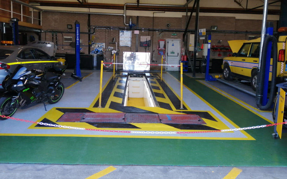 Heavy duty epoxy resin floor paint creating a safe working layout at East Midlands Airport by CCS Garage Equipment