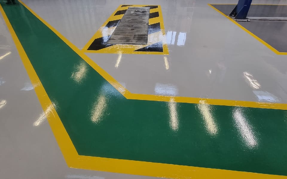 Safety markings and guided walkways to indicate hazards and help to prevent falls at East Midlands Airport, enhancing our client’s workshop safety and regulatory compliance