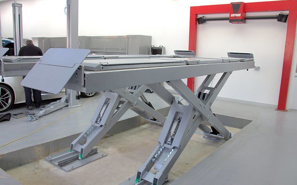 Recessed scissor lift installed by CCS Garage Equipment in dedicated wheel alignment bay, creating ease of access for low-profile vehicles