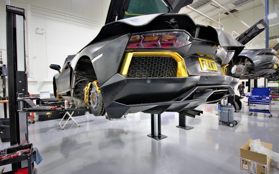 Fixed 2-post vehicle lifts and bespoke workshop cabinets by Dura, installed by CCS Garage Equipment at Lamborghini, School Road’s workshop