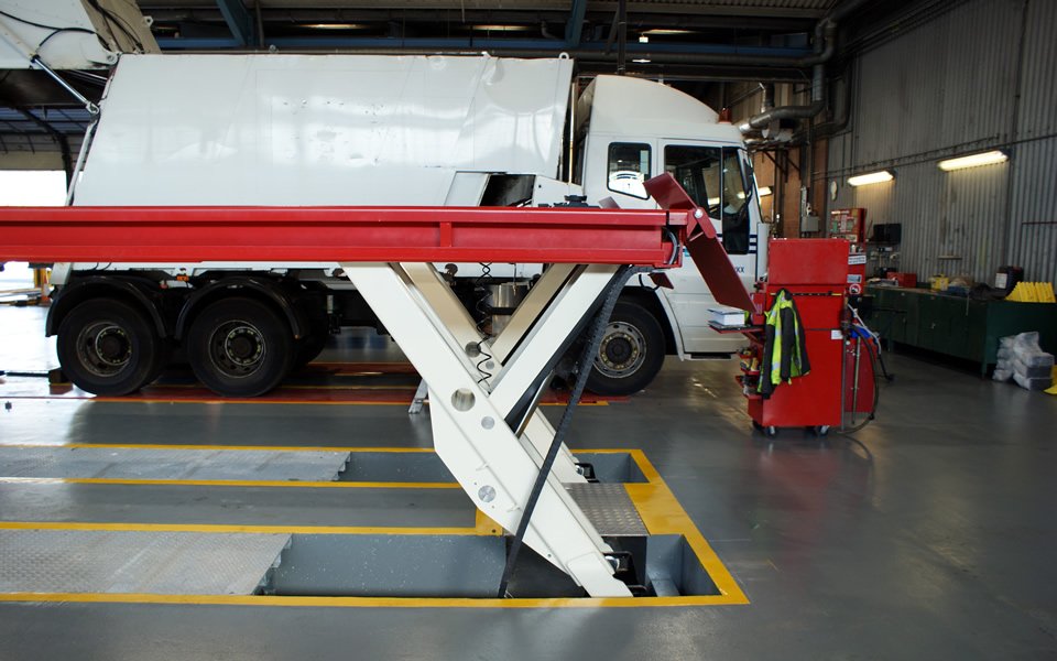 Garage equipment installation featuring bespoke, drive-on commercial vehicle lifting platforms for Poole Council by CCS Garage Equipment