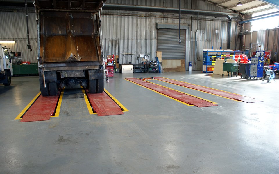 Twin drive-on, commercial vehicle lifting platforms for HGVs ready for use, installed by CCS Garage Equipment for Poole Council