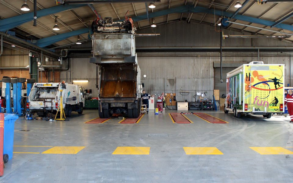 Refuse trucks and local authority public events van ready to be serviced by Poole Council workshop engineers using Stertil Koni commercial vehicle lifting platforms installed by CCS Garage Equipment