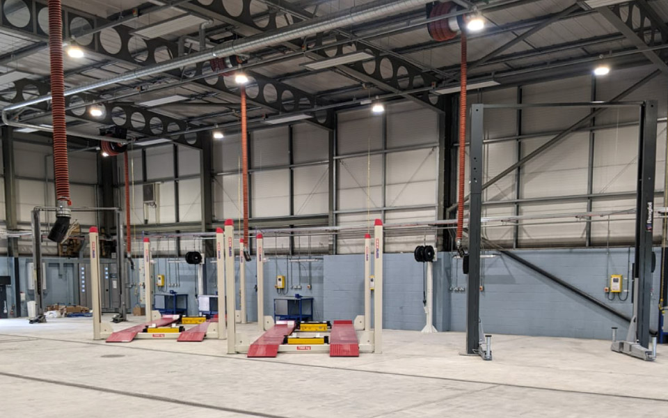 Completed garage equipment installation, including installation of 7T 4-post and 2-post commercial vehicle lifts for the maintenance of ambulance service vehicles